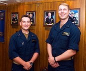 230715-N-JC445-1010 MEDITTERREAN SEA (July 15, 2023) Ensign Matthew Hedish and Ensign Michael Johnson pose for a photo in the ceremonial quarterdeck aboard the Blue Ridge-class command and control ship USS Mount Whitney (LCC 20). Mount Whitney is the U.S. 6th Fleet flagship, homeported in Gaeta, and operates with a combined crew of U.S. Sailors and Military Sealift Command civil service mariners. (U.S. Navy photo by Mass Communication Specialist 2nd Class Mario Coto)