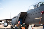 A U.S. Air Force pilot answers questions about his aircraft at the 2023 Royal International Air Tattoo at RAF Fairford, England, July 15, 2023. RIAT participation demonstrates U.S. commitment to European allies and partners while highlighting U.S. capabilities to a diverse audience, emphasizing unity, innovation, and a shared commitment to excellence. (U.S. Air Force photo by 1st Lt. Symantha King)