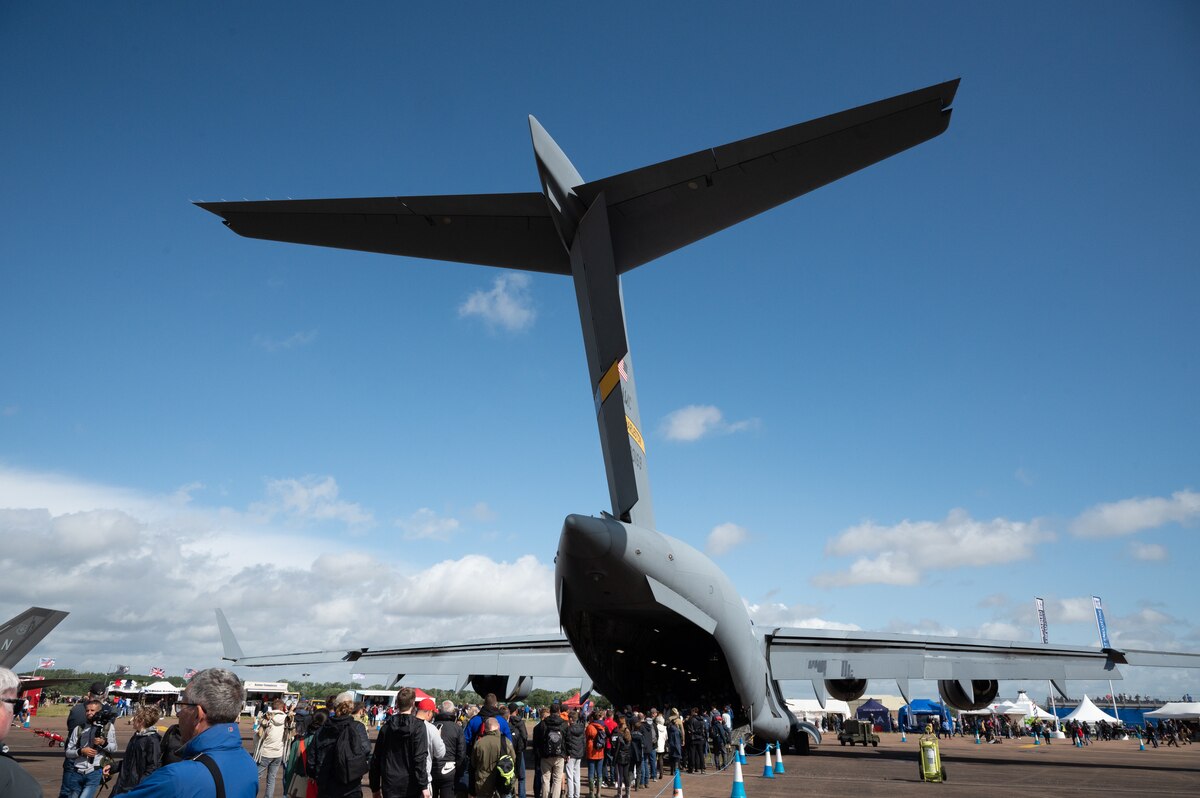 Crowds gather to view a U.S. C-17 Globemaster III at the 2023 Royal International Air Tattoo at RAF Fairford, England, July 15, 2023. RIAT participation demonstrates U.S. commitment to European allies and partners while highlighting U.S. capabilities to a diverse audience, emphasizing unity, innovation, and a shared commitment to excellence. (U.S. Air Force photo by 1st Lt. Symantha King) (U.S. Air Force photo by 1st Lt. Symantha King)