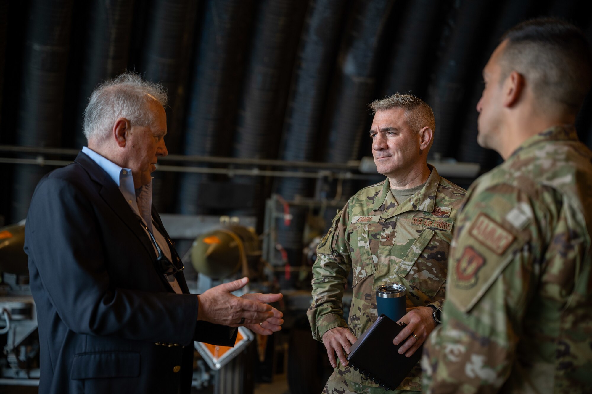 Secretary of the Air Force Frank Kendall talks with U.S. Air Force Brig. Gen. Joseph Campo, 48th Fighter Wing commander, at RAF Lakenheath, England, July 13, 2023. As one of the key stops during the visit, 48th MUNS showcased conventional employment concepts and demonstrated how they have maintained a ready and alert posture, which has proven successful in recent real world taskings. (U.S. Air Force photo by Airman 1st Class Seleena Muhammad-Ali)