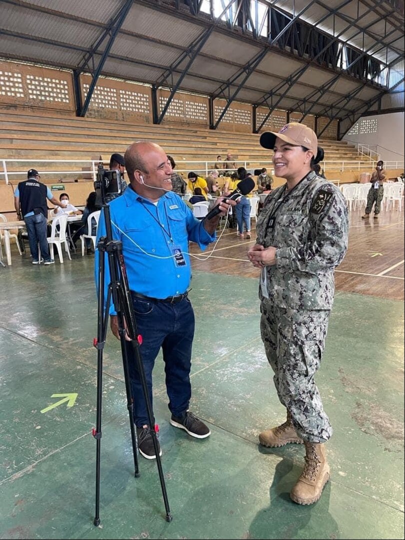 (Contributed Photo) Navy Lt. Lizette Gonzalez provides remarks to a media member while deployed with the USNS Comfort in support of Continuing Promise 2022 as their Host Nation Military Liaison to five different countries in South America.  Gonzalez recently concluded a tour aboard Naval Health Clinic Cherry Point as the Department Head of Patient Administration.