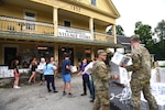 U.S. Army Staff Sgt. John Hackley and Sgt. Jeffrey Coleman, both truck drivers, Alpha Company, 186th Brigade Support Battalion, 86th Infantry Brigade Combat Team (Mountain), Vermont Army National Guard, help unload water, Marshfield, Vt., July 13, 2023.