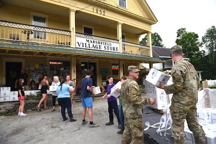 U.S. Army Staff Sgt. John Hackley and Sgt. Jeffrey Coleman, both truck drivers, Alpha Company, 186th Brigade Support Battalion, 86th Infantry Brigade Combat Team (Mountain), Vermont Army National Guard, help unload water, Marshfield, Vt., July 13, 2023.