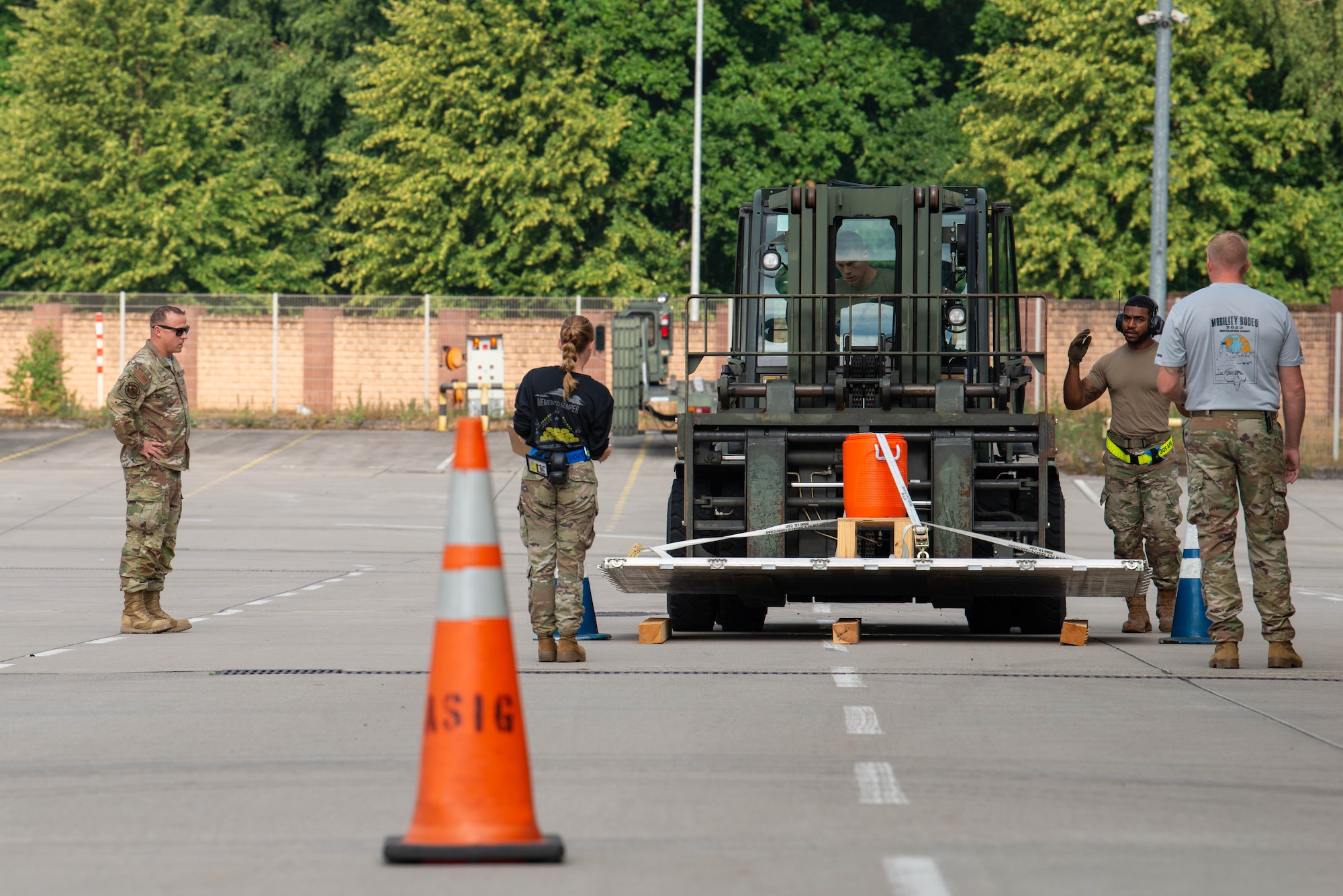 U.S. Air Force Airmen assigned to the 305th Aerial Port Squadron, Joint Base McGuire-Dix-Lakehurst, New Jersey, maneuver a forklift through a driving course during the 521st Air Mobility Operations Wing’s Mobility Rodeo at Ramstein Air Base, Germany, July 12, 2023.