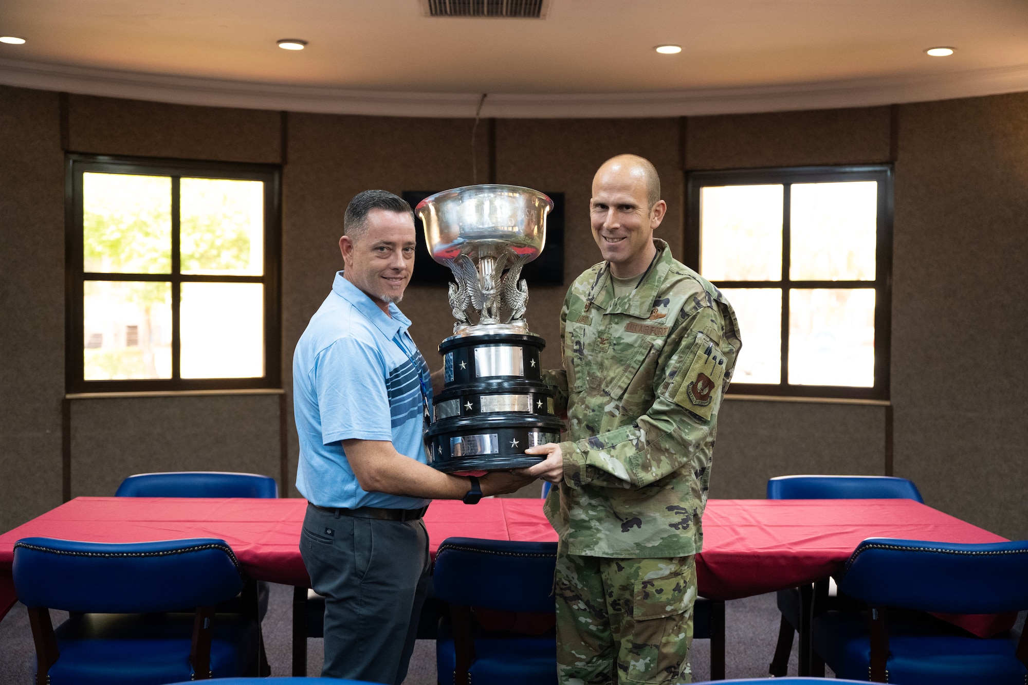 Col. Kevin Lord, 39th Air Base Wing commander, presents the John L. Hennessy award to Patrick Guthrie, Sultan's Inn dining facility manager at Incirlik Air Base, July 6, 2023.