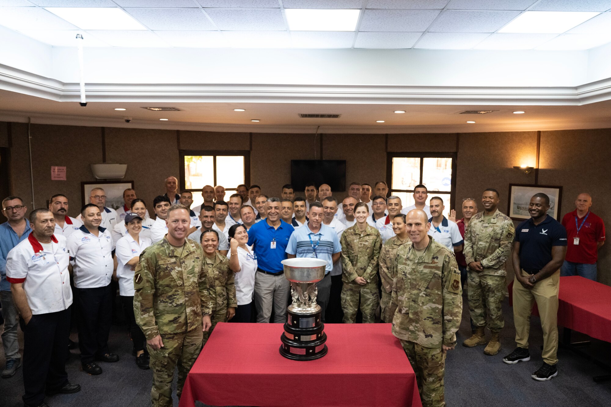Sultan's Inn dining facility staff and military personnel pose with the John L. Hennessy award at Incirlik Air Base, July 6, 2023.