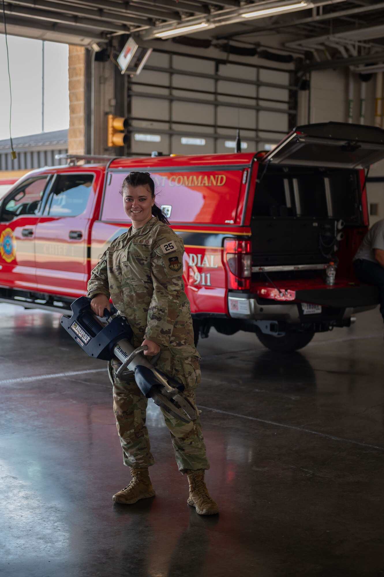 U.S. Air Force Academy cadet Carissa Sigler familiarizes herself with the Jaws of Life during an Operation Air Force visit at Seymour Johnson Air Force Base, North Carolina, July 8, 2023.The base firefighters used the Jaws of Life, as well as other rescue tools and techniques to mimic a real-world situations. (U.S. Air Force photo by Airman 1st Class Rebecca Sirimarco-Lang)