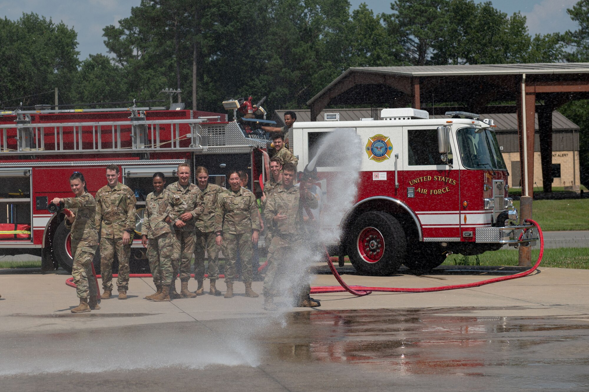 U.S. Air Force Academy cadets learn techniques to put out a fire during an Operation Air Force visit at Seymour Johnson Air Force Base, North Carolina, July 8, 2023. The Operation Air Force focuses on orienting cadets on missions, organizational structure and culture through direct exposure and experience to the U.S. Air Force and Space Force units. (U.S. Air Force photo by Airman 1st Class Rebecca Sirimarco-Lang)