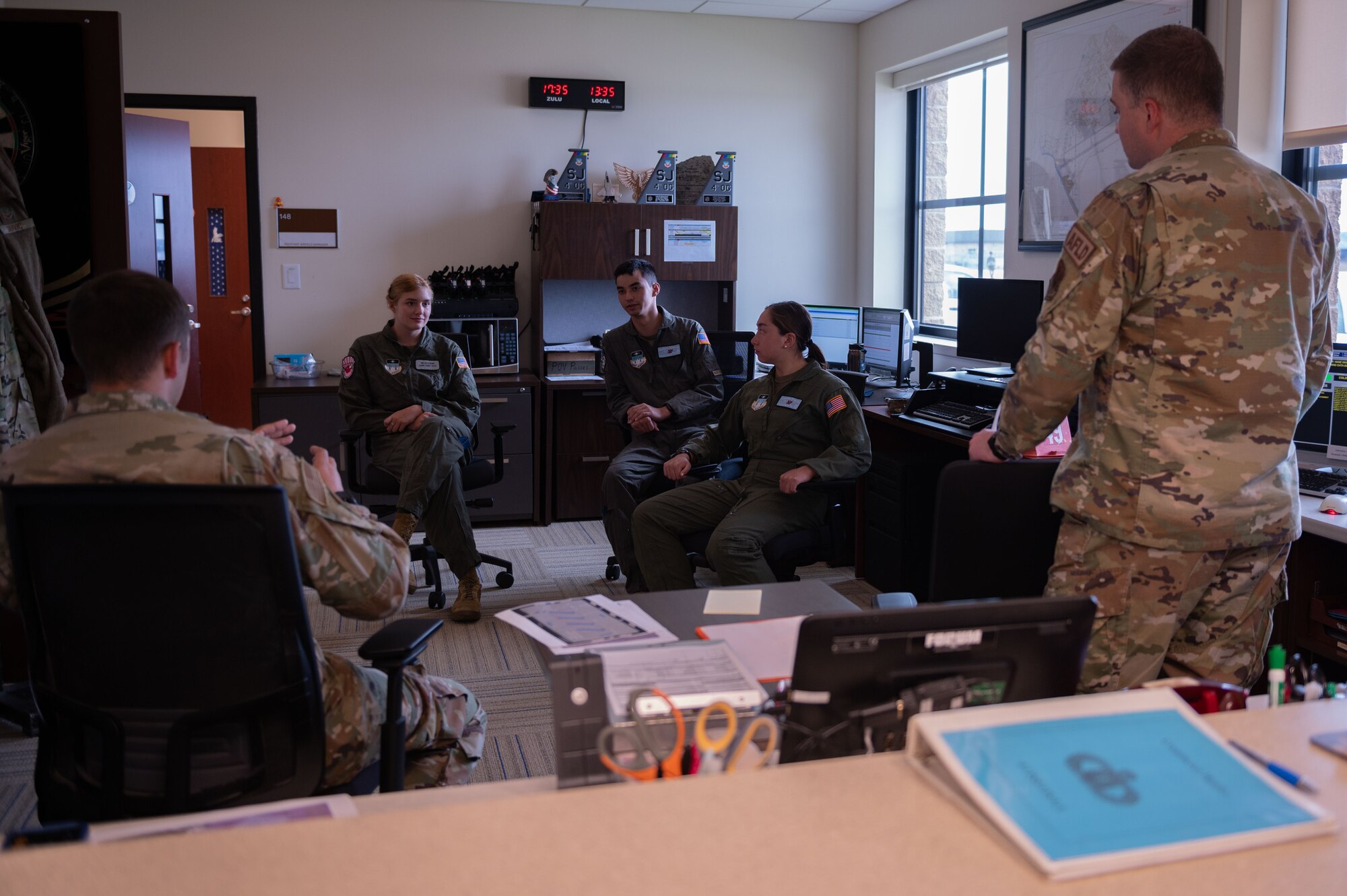 U.S. Air Force Academy cadets listen to the 4th Operations Support Squadron airfield management mission brief during an Operation Air Force visit at Seymour Johnson Air Force Base, North Carolina, July 10, 2023. The Operation Air Force focuses on orienting cadets on missions, organizational structure and culture through direct exposure and experience to the U.S. Air Force and Space Force units. (U.S. Air Force photo by Airman 1st Class Rebecca Sirimarco-Lang)