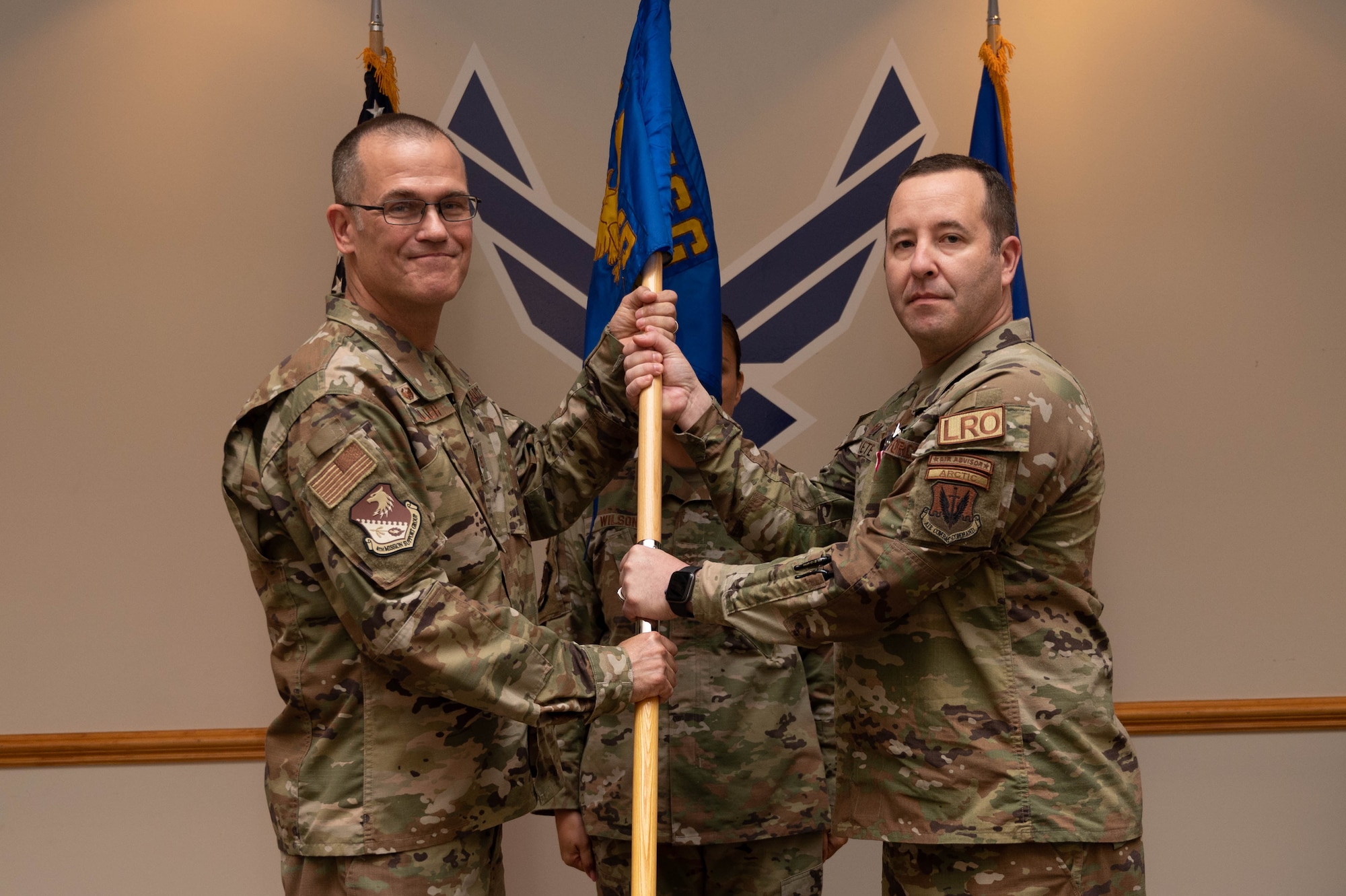 Col. Todd Walker, 4th Mission Support Group Commander,  relieves Lt. Col. Robert Fekete of his duty as commander of the 4th Logistics Readiness Squadron during a change of command ceremony at Seymour Johnson Air Force Base, July 14, 2023. The ceremony was conducted to commemorate the passing of command of the 4th Logistics Readiness Squadron from Fekete to Maj. Lovell C.K. Davis Jr. (U.S. Air Force photo by Staff Sgt. Koby I. Saunders)