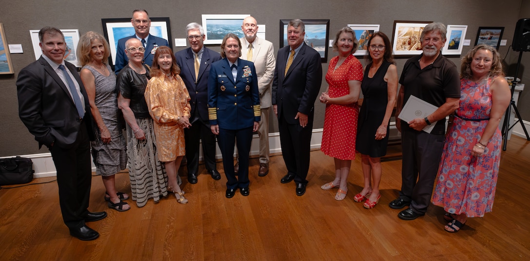 Admiral Linda L. Fagan, Commandant of the Coast Guard, poses with some of the artists of the 2023 Coast Guard art program exhibit, Jul. 13, 2023. The Coast Guard Art Program celebrated its 42nd anniversary at the Salmagundi Club in New York.