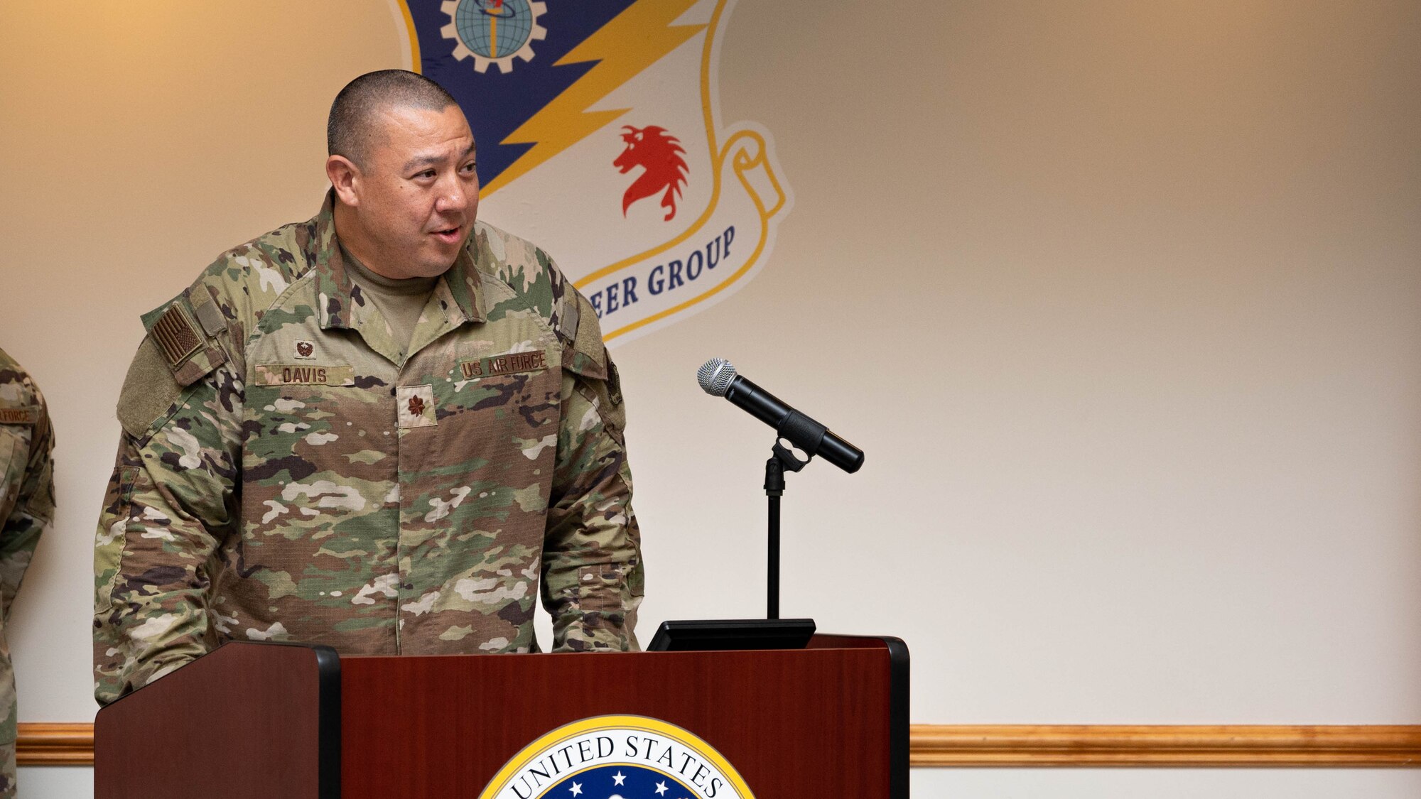 Maj. Lovell C.K. Davis Jr., 4th Logistics Readiness Squadron commander, speaks to an audience during a change of command ceremony at Seymour Johnson Air Force Base, July 14, 2023. The ceremony was conducted to commemorate the passing of command of the 4th Logistics Readiness Squadron from Lt. Col. Robert Fekete to Maj. Lovell C.K. Davis Jr. (U.S. Air Force photo by Staff Sgt. Koby I. Saunders)