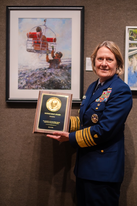 U.S. Coast Guard Commandant, Admiral Linda L. Fagan presents the George Gray award in recognition of support of the Coast Guard Art Program, Jul. 13, 2023 at the Salmagundi Club in New York. This year winner was artist John Ward, who highlighted MH-65 dolphin helicopter rescue operations.