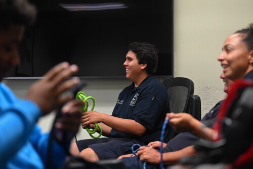 Justin Nava, 17th Civil Engineer Squadron firefighter, teaches a class on ropes and knots during Junior Firefighter Camp at the fire station, Goodfellow Air Force Base, Texas, July 12, 2023. Junior Firefighter Camp gives children aged 10-12 an opportunity to learn basic skills from firefighters in a fun, engaging way. Justin Nava attended the camp for two years when he was eligible, after aging out he continued to volunteer with the fire station during camp and Fire Prevention Week. (U.S. Air Force photo by Airman 1st Class Madison Collier)