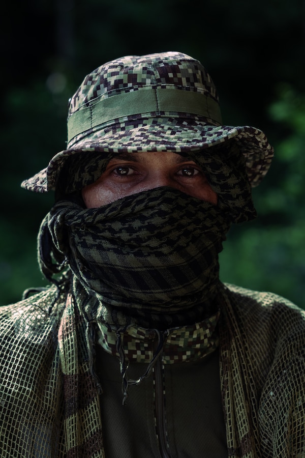 A Colombian reconnaissance Marine is photographed during jungle patrolling training for UNITAS LXIV at Cartagena, Colombia, July 15, 2023. During UNITAS, reconnaissance and special operation force Marines from partnered and allied nations conducted multilateral special operations training consisting of room clearing, visit board search and seizure, jungle patrolling, low level static line jumping, small arms, and helicopter rope suspension tactics. UNITAS,  taking place in Colombia this year, is the world’s longest-running annual multinational maritime exercise that focuses on enhancing interoperability among multiple nations and joint forces during littoral and amphibious operations in order to build on existing regional partnerships and create new enduring relationships that promote peace, stability, and prosperity in the U.S. Southern Command’s area of responsibility. (U.S. Marine Corps photo by Sgt. Colton K. Garrett)