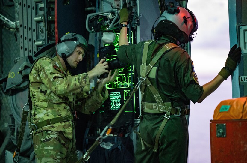 Staff Sgt. Taylor Crul, 1st Combat Camera aerial combat photographer, documents a search-and-rescue operation while taking part in Mobility Guardian 2023 off the coast of Rota, Commonwealth of the Northern Mariana Islands, July 10, 2023.