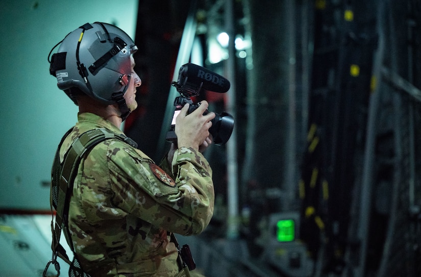 Staff Sgt. Taylor Crul, 1st Combat Camera aerial combat photographer, documents a search-and-rescue operation while taking part in Mobility Guardian 2023 off the coast of Rota, Commonwealth of the Northern Mariana Islands, July 10, 2023.