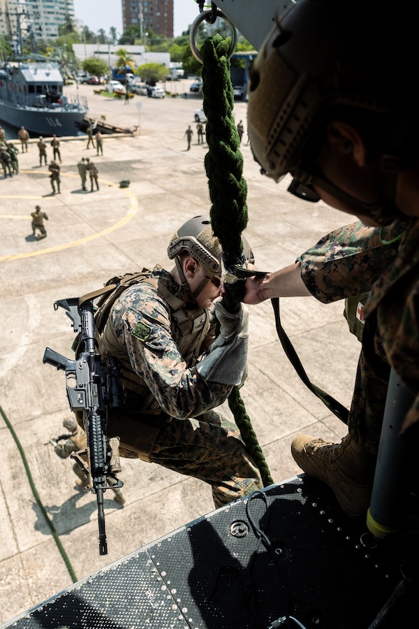 A U.S. reconnaissance Marine with 4th Reconnaissance Battalion, 4th Marine Division, fast ropes from a U.S. Marine Corps UH-1Y Venom during helicopter rope suspension tactics training for UNITAS LXIV at Cartagena, Colombia, July 13, 2023. During UNITAS, reconnaissance and special operation force Marines from 11 partnered and allied nations conducted multilateral special operations training consisting of HRST, room clearing, visit board search and seizure, jungle patrolling, low level static line jumping, and small arms tactics. UNITAS, which is taking place in Colombia this year, is the world’s longest-running annual multinational maritime exercise that focuses on enhancing interoperability among multiple nations and joint forces during littoral and amphibious operations in order to build on existing regional partnerships and create new enduring relationships that promote peace, stability, and prosperity in the U.S. Southern Command’s area of responsibility. (U.S. Marine Corps photo by Sgt. Colton K. Garrett)