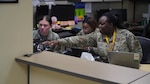 U.S. Air Force Staff Sgt. Kayla D. Britford, 88th Medical Group’s Physical Medicine Technician, assists other Airmen with the MHS Genesis switchover inside the Wright-Patterson Medical Center, June 3,2023. The Department of Defense’s new electronic health record (EHR), MHS GENESIS, has officially launched at Wright-Patterson Medical Center. (Air Force photo by Kenneth J. Stiles)