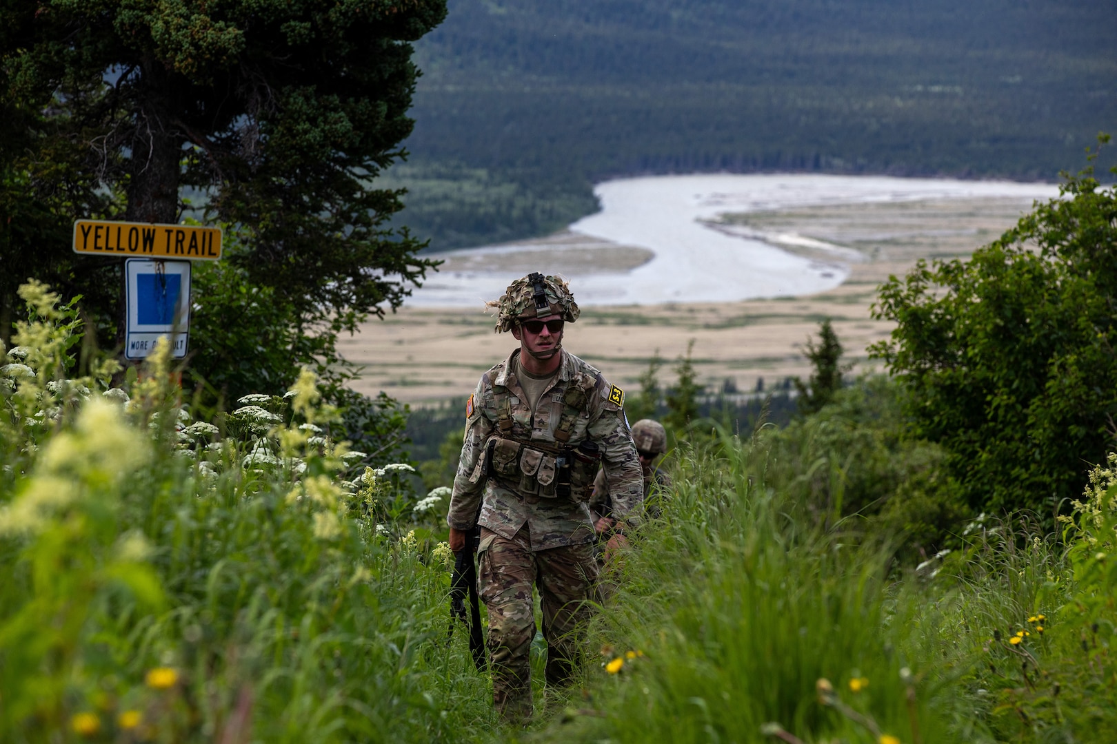 U.S. Army Spc. Jackson Jacobs, an artillery forward observer assigned to the Tennessee Army National Guard, representing Region III, rucks Hippie Trail during the 2023 Army National Guard Best Warrior Competition at Black Rapids Training Area, Alaska on July 10, 2023.