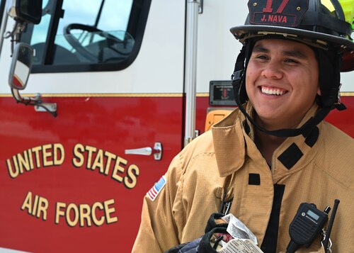 Justin Nava, 17th Civil Engineer Squadron firefighter, laughs with his coworkers at the fire station, Goodfellow Air Force Base, Texas, June 30, 2023. Nava was recently brought into the fire department after years of attending public events and volunteering in his spare time on base with the department. Unlike his peers, Nava holds no prior military experience and earned all his training and certifications through local programs. (U.S. Air Force photo by Airman 1st Class Madison Collier)