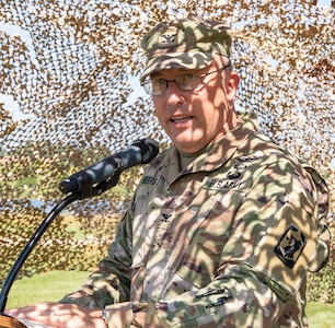 Col. David Helfrich, of Smithton, Illinois, incoming commander of the 404th Maneuver Enhancement Brigade, addresses the brigade’s Soldiers during the change of command ceremony July 14 at the brigade’s headquarters on the campus of Heartland Community College in Normal, Illinois. Helfrich assumed command from Col. Kevin Little, of Franklin, Illinois, during the ceremony.