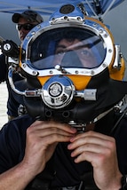 CARTAGENA, COLOMBIA (July 14, 2023) - Navy Diver 1st Class Michael Clutch, assigned to Mobile Diving and Salvage Unit 2 (MDSU-2) performs pre-dive checks aboard ARC Golfo de Morrosquillo (LD 242) during UNITAS LXIV, July 14, 2023.