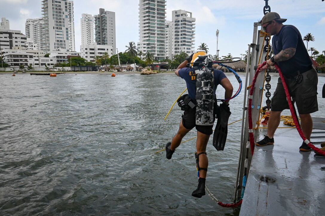 Navy Diver 2nd Class Jeremy Deato, assigned to Mobile Diving and Salvage Unit 2 (MDSU-2) enters the water from ARC Golfo de Morrosquillo (LD 242) during diving operations with the Colombian Navy during UNITAS LXIV, July 14, 2023.