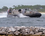Ship to Shore Connector (SSC), Landing Craft, Air Cushions (LCAC) 105-107 received a lift of opportunity (LOO) aboard USS Gunston Hall (LSD 44), on July 14.