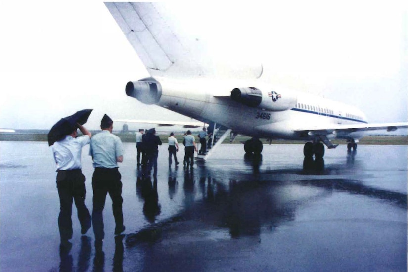 Troops board a military aircraft.