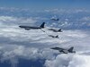 U.S. Marine Corps F/A-18 Hornets assigned to Marine Fighter Attack Squadron 323, Marine Aircraft Group 11, 3rd Marine Aircraft Wing, conduct air-to-air refueling with a U.S. Air Force KC-135 Stratotanker during a trans-Pacific flight en route to Marine Aviation Support Activity 23, at sea, July 8, 2023. MASA is a bilateral exercise between the Armed Forces of Philippines and the U.S. Marine Corps, aimed at enhancing interoperability and coordination focused on aviation-related capabilities.