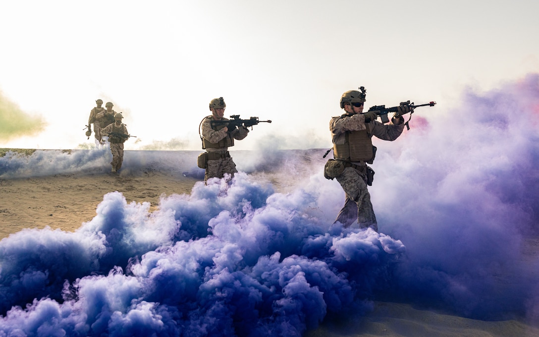 U.S. Marines with Marine Forces Command move through obscuration while conducting Military Operations in Urbanized Terrain training during exercise Intrepid Maven 23.3 in the United Arab Emirates, May 19, 2023. Intrepid Maven 23.3 is a Task Force 51/5-led bilateral exercise between MARCENT and the United Arab Emirates Armed Forces designed to improve interoperability, strengthen partner-nation relationships in the U.S. Central Command area of responsibility and improve both individual and bilateral unit readiness.