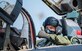 Senior Airman Kostiantyn Khymchenko is surpirsed on the flightline by his family, friends, coworkers, the COMACC and the command chief of ACC