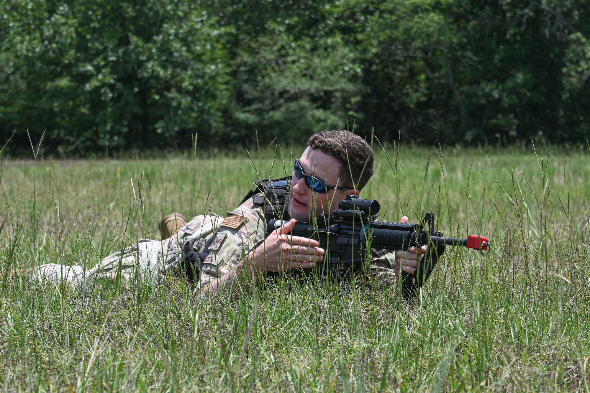 man in uniform teaches basic tactical movement