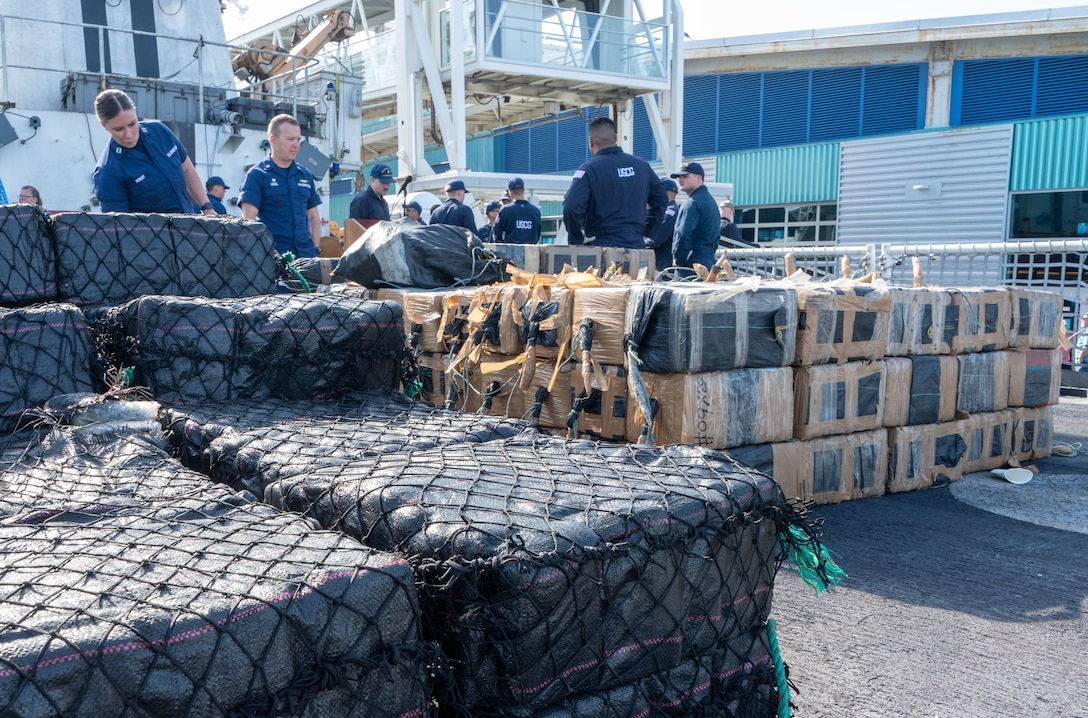 Crew members offload interdicted, illegal drugs in San Diego.