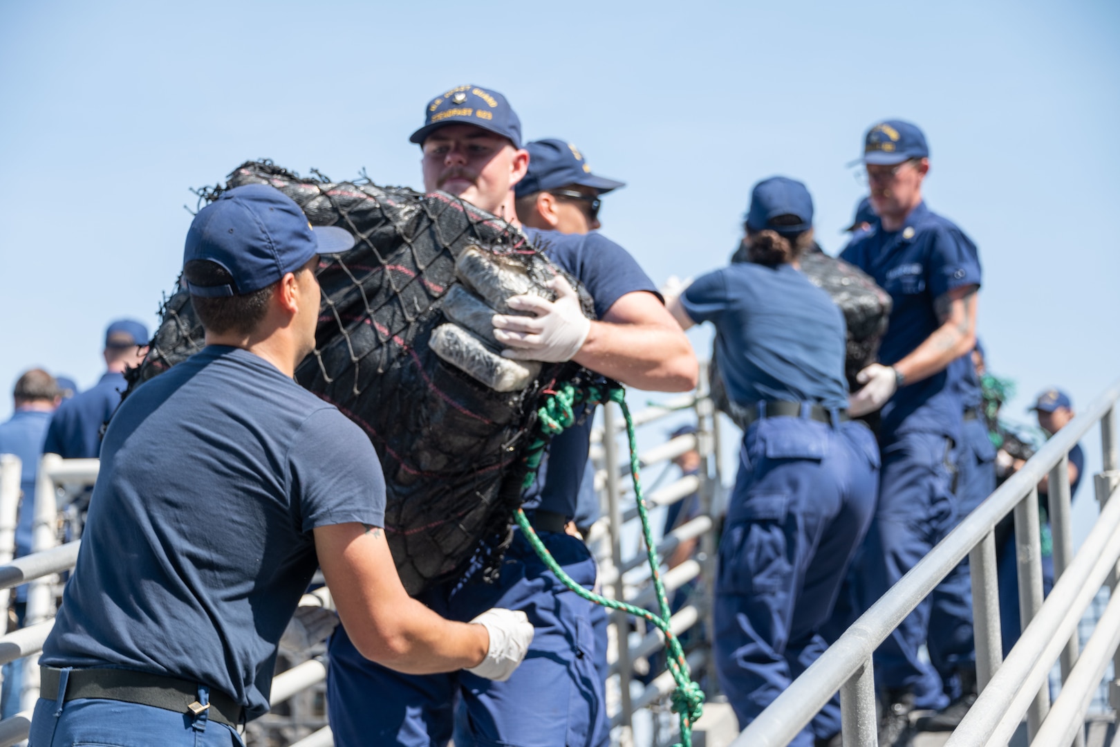 Coast Guard members offload interdicted, illegal drugs in San Diego, March 28, 2023.