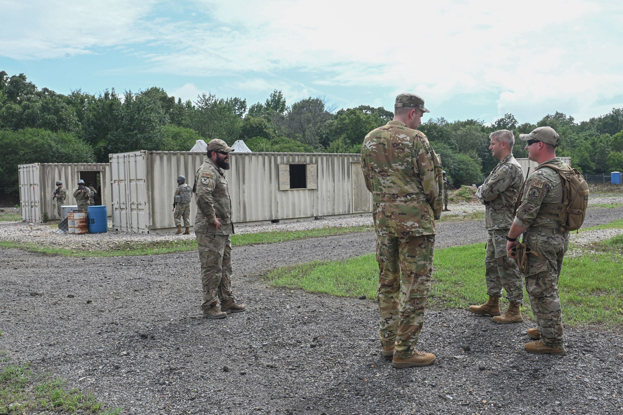 men in uniform observe an exercise