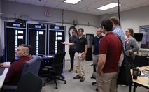 Dr. Christian Schegan demonstrates capabilities of the Machinery Research & Silencing Division Flex Labs’ Real-Time Simulation (RTS) and Hardware-in-the-loop (HIL) capability that is being used to support the Office of Naval Research (ONR) Robust Combat Power Controls (RCPC) Future Naval Capability (FNC) during the Naval Surface Warfare Center, Philadelphia Division (NSWCPD) Machinery Research & Silencing Division Technical Meet and Greet on June 7, 2023. (U.S. Navy photo by Margaret A. Kenyon/Released)