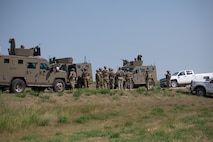 Airmen from the 91st Missile Security Forces Squadron, and the 219th Security Forces Squadron congregate after completing a convoy to a missile site at Minot Air Force Base, July 10, 2023. The convoy was a part of Operation Bullystick. Operation Bullystick was an event held to test agile combat employment concepts using a Minuteman III intercontinental ballistic missile.(U.S. Air Force photos by Airman 1st Class Trust Tate)