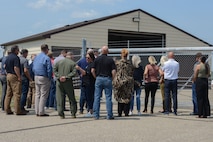 Civic Leaders wait behind the fence of a Missile Alert Facility, Minot Air Force Base, North Dakota, July 13, 2023. MAFs are the link to the launch control centers connected via computer to intercontinental ballistic missiles. (U.S. Air Force photo by Airman 1st Class Trust Tate)