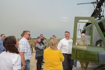 Civic leaders of the Minot community observe the UH-1N Iroquois Helicopter at Minot Air Force Base, North Dakota, July 13, 2023. Civilian leader tours are intended to teach community members about the mission at Minot Air Force Base and emphasize the importance of the roles played by the public in the lives of Minot Airmen. (U.S. Air Force photo by Airman 1st Class Trust Tate)