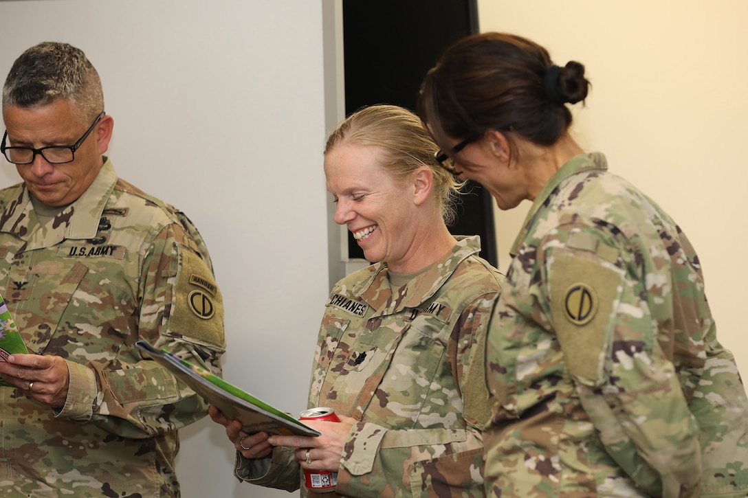 U.S. Army Reserve Soldiers, assigned to the 85th U.S. Army Reserve Support Command, laugh during the 85th U.S. Army Reserve Support Command Chaplain's office Building Strong and Ready Teams event, at the headquarters battle assembly, July 15, 2023.