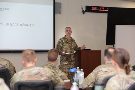 U.S. Army Reserve Maj. Gregory Poulos conducts a brief during the 85th U.S. Army Reserve Support Command Chaplain's office Building Strong and Ready Teams event, at the headquarters battle assembly, July 15, 2023.