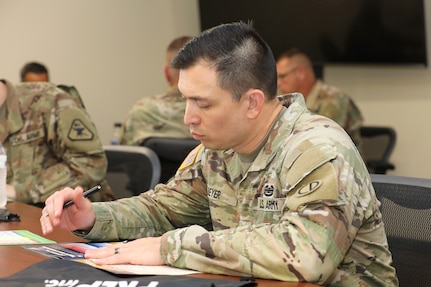 U.S. Army Reserve Sgt. 1st Class Tony-James Beyer, assigned to the 85th U.S. Army Reserve Support Command Staff Judge Advocate office, participates in an exercise during the 85th U.S. Army Reserve Support Command Chaplain's office Building Strong and Ready Teams event, at the headquarters battle assembly, July 15, 2023.