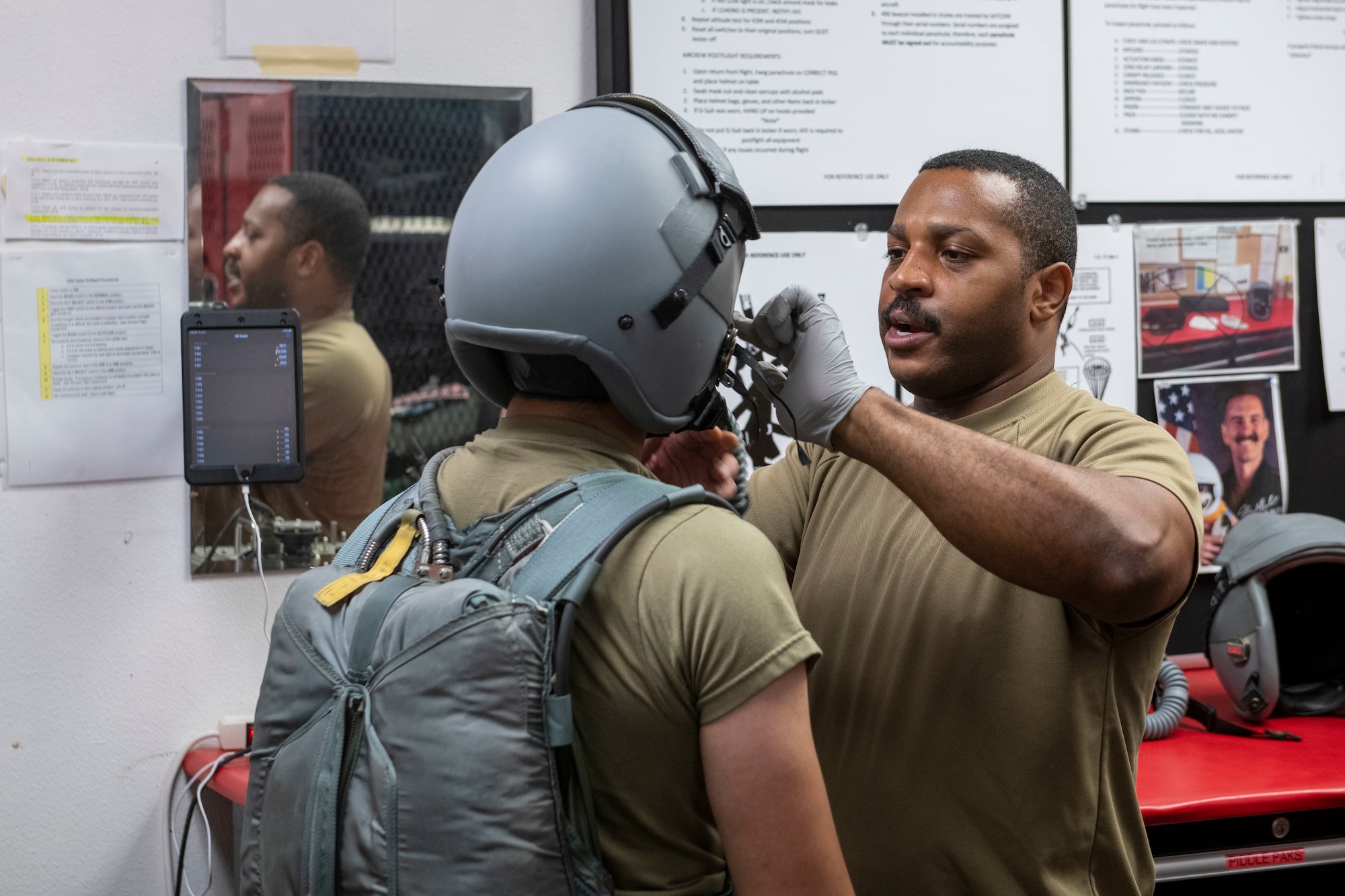 U.S. Air Force Master Sgt. Marques Bones, 9th Force Support Squadron development advisor, conducts a flight breathing simulation on U.S. Air Force Airman 1st Class Jeffrey Joo, 9th Maintenance Squadron aircrew egress systems, July 14, 2023, at Beale Air Force Base, California.