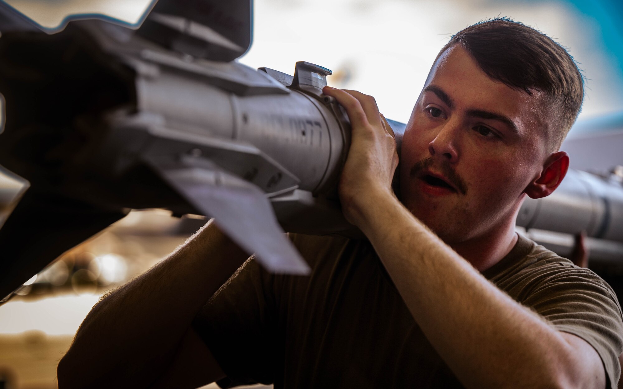 U.S. Air Force Airmen assigned to the 56th Fighter Wing participate in the second quarter weapons load competition