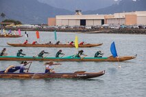 Race participants compete during the 2023 John D. Kaupiko Canoe Regatta at Marine Corps Base Hawaii, July 16, 2023. Eighteen canoe clubs across Oahu competed in 45 divisions, paddling through Kaneohe Bay for first place. MCBH hosted the canoe regatta in conjunction with the Hui Nalu Canoe Club as an opportunity to foster relations between the base and the local community. (U.S. Marine Corps photo by Sgt. Julian Elliott-Drouin)