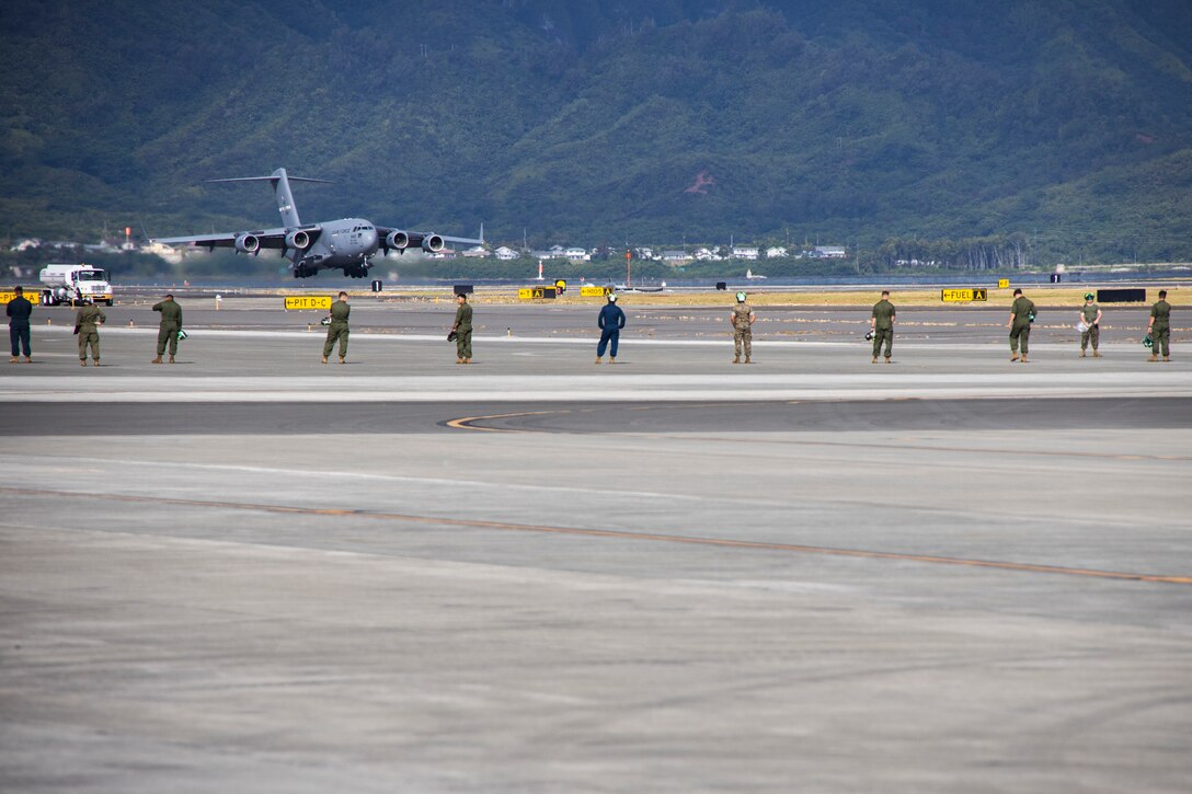 A U.S. Air Force C-17 Globemaster III assigned to 21st Airlift Squadron, 60th Air Mobility Wing, lands during a Strategic Mobility Exercise at Marine Corps Air Station Kaneohe Bay, Marine Corps Base Hawaii, July 7, 2023. Marines with 3rd Marine Littoral Regiment, 3rd Marine Division, III Marine Expeditionary Force, loaded approximately 400,000 pounds of equipment onto five C-17 Globemaster IIIs along with 100 passengers to be transported to the Philippines in support of Marine Aviation Support Activity 23. MASA 23 aims to enhance the capabilities of the Philippine Marine Corps, Philippine Navy, U.S. Marine Corps Forces, Pacific, Philippine Air Force, and Philippine Naval Air Wing through bilateral engagements and training. (U.S. Marine Corps photo by Sgt. Julian Elliott-Drouin)