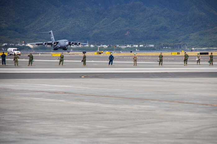 A U.S. Air Force C-17 Globemaster III assigned to 21st Airlift Squadron, 60th Air Mobility Wing, lands during a Strategic Mobility Exercise at Marine Corps Air Station Kaneohe Bay, Marine Corps Base Hawaii, July 7, 2023. Marines with 3rd Marine Littoral Regiment, 3rd Marine Division, III Marine Expeditionary Force, loaded approximately 400,000 pounds of equipment onto five C-17 Globemaster IIIs along with 100 passengers to be transported to the Philippines in support of Marine Aviation Support Activity 23. MASA 23 aims to enhance the capabilities of the Philippine Marine Corps, Philippine Navy, U.S. Marine Corps Forces, Pacific, Philippine Air Force, and Philippine Naval Air Wing through bilateral engagements and training. (U.S. Marine Corps photo by Sgt. Julian Elliott-Drouin)