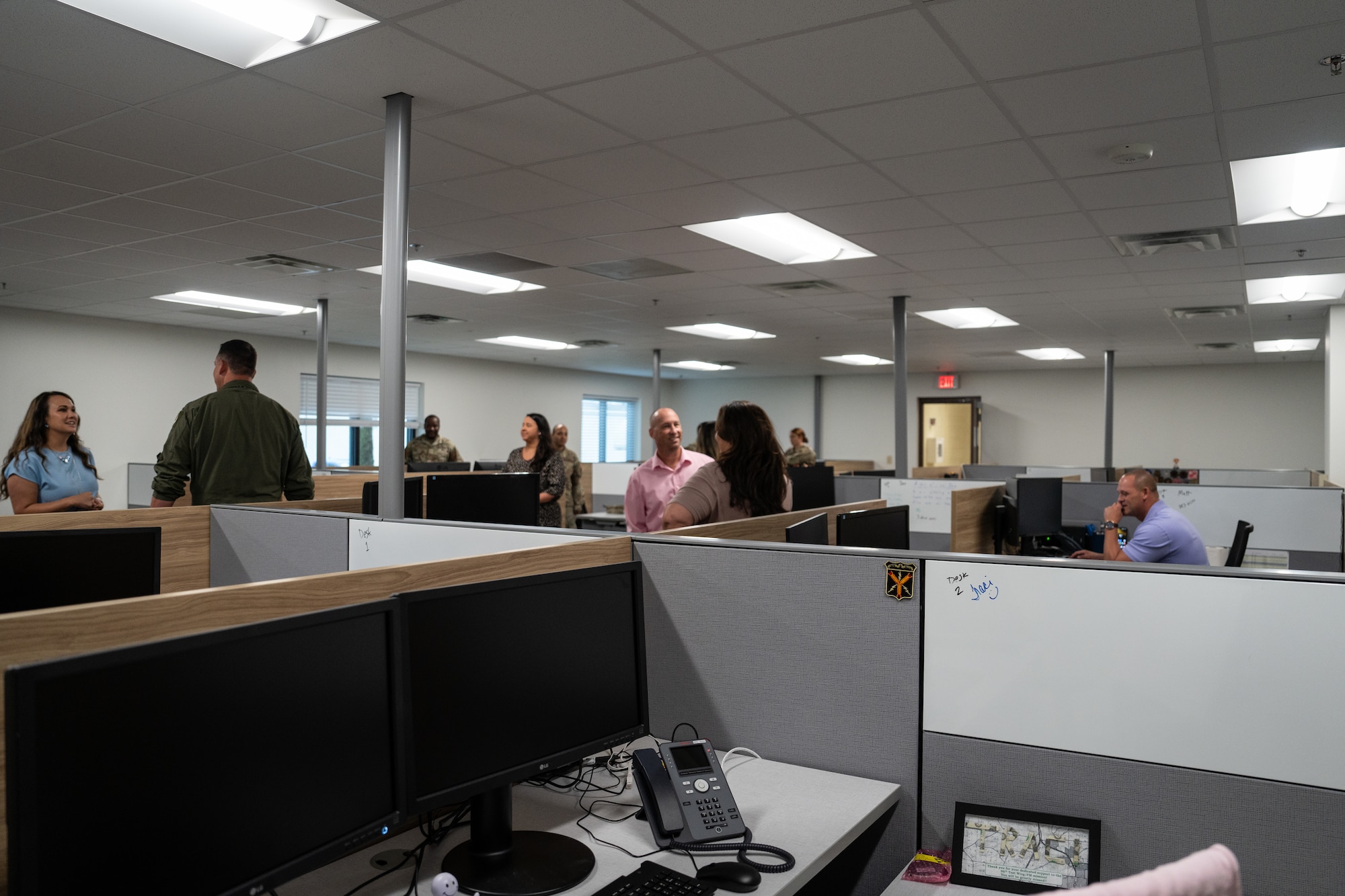 Members from the 350th Spectrum Warfare Wing tour their new office spaces at Eglin Air Force Base, Fla., July 14, 2023. Renovating this facility provided the wing with an opportunity for a new space features a 15-person team room, and a break room with two extra floating workspaces. (Courtesy Photo)